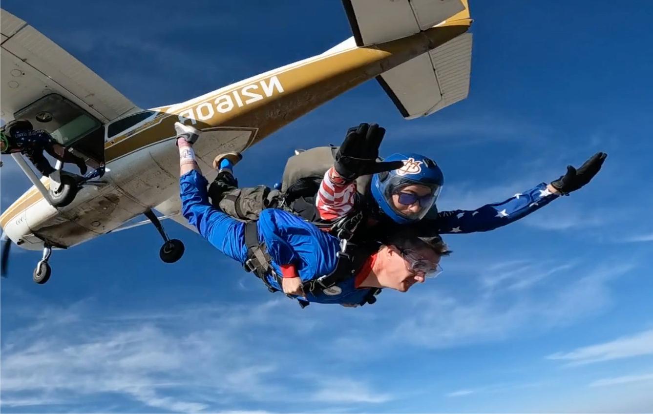 President John Marshall skydiving to gain a new perspective of our "Human Scale" university.